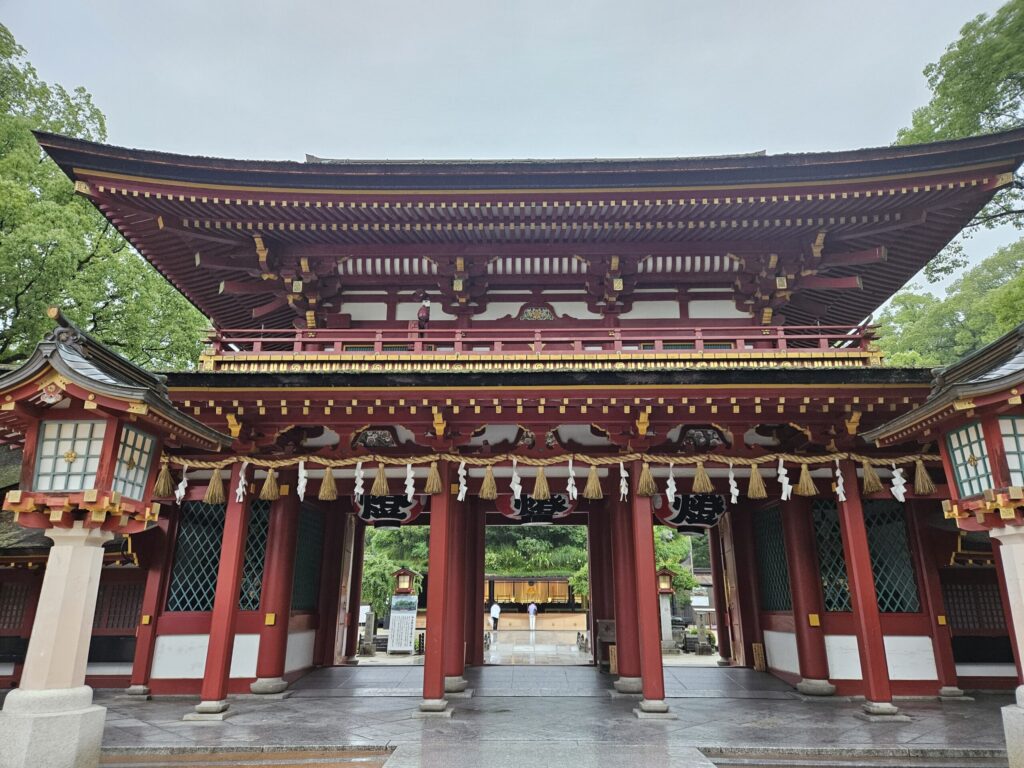 Romon Gate of Dazaifu Tenmangu Shrine with visitors walking through