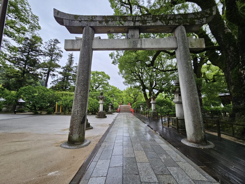 Torii gate and the stone-paved path leading to Dazaifu Tenmangu Shrine