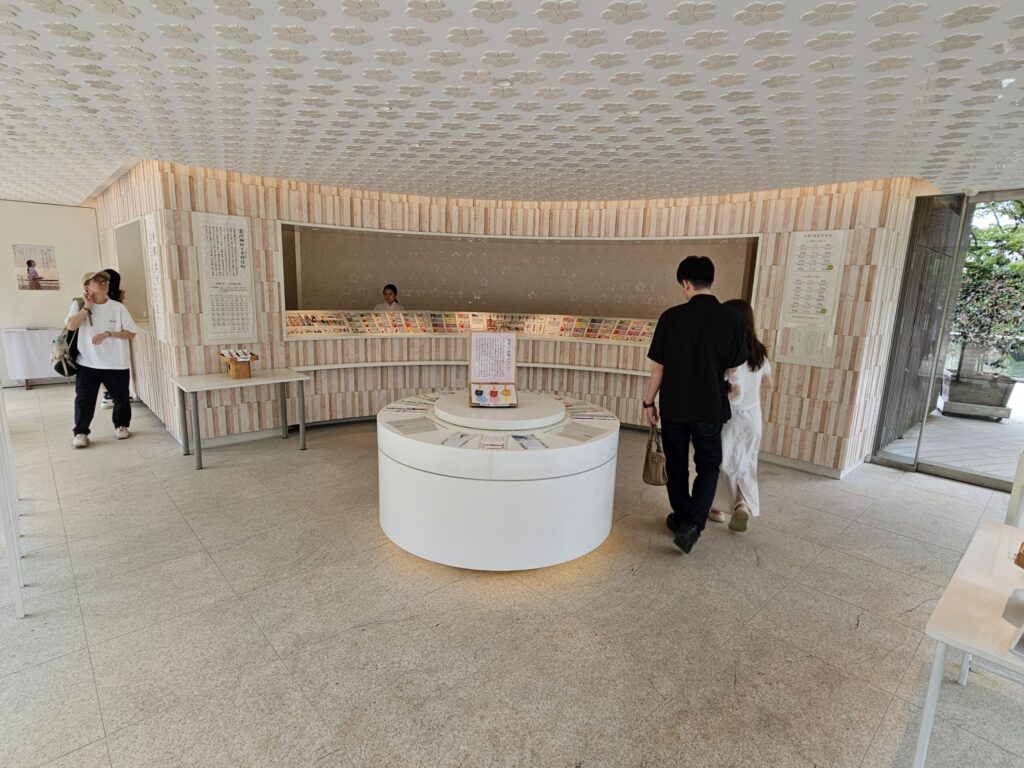 Kamado Shrine’s modern shrine office — looks like a boutique with warm wood and glass design.
