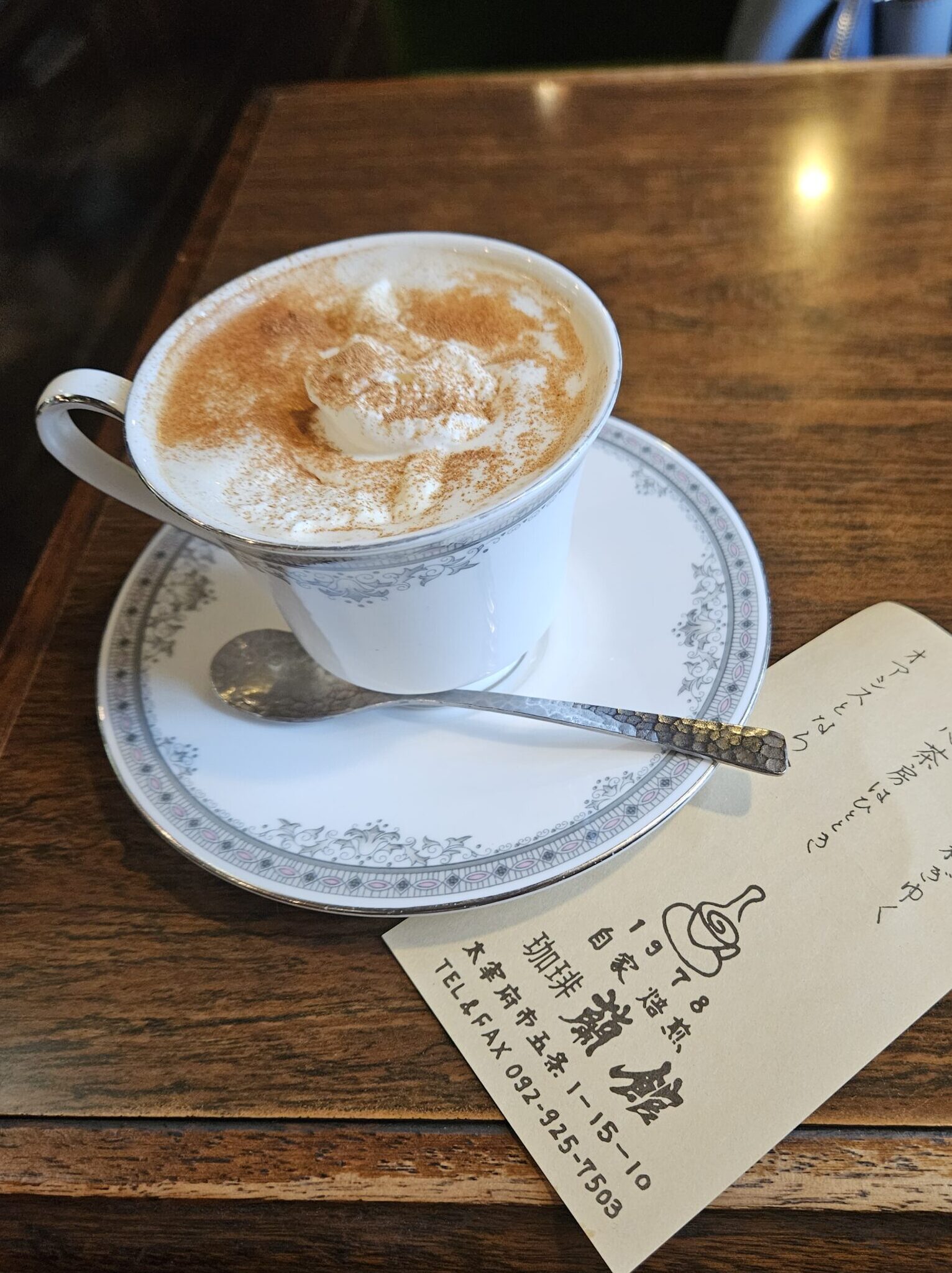 Cappuccino topped with generous cinnamon at Café Ran Kan near Dazaifu Tenmangu.