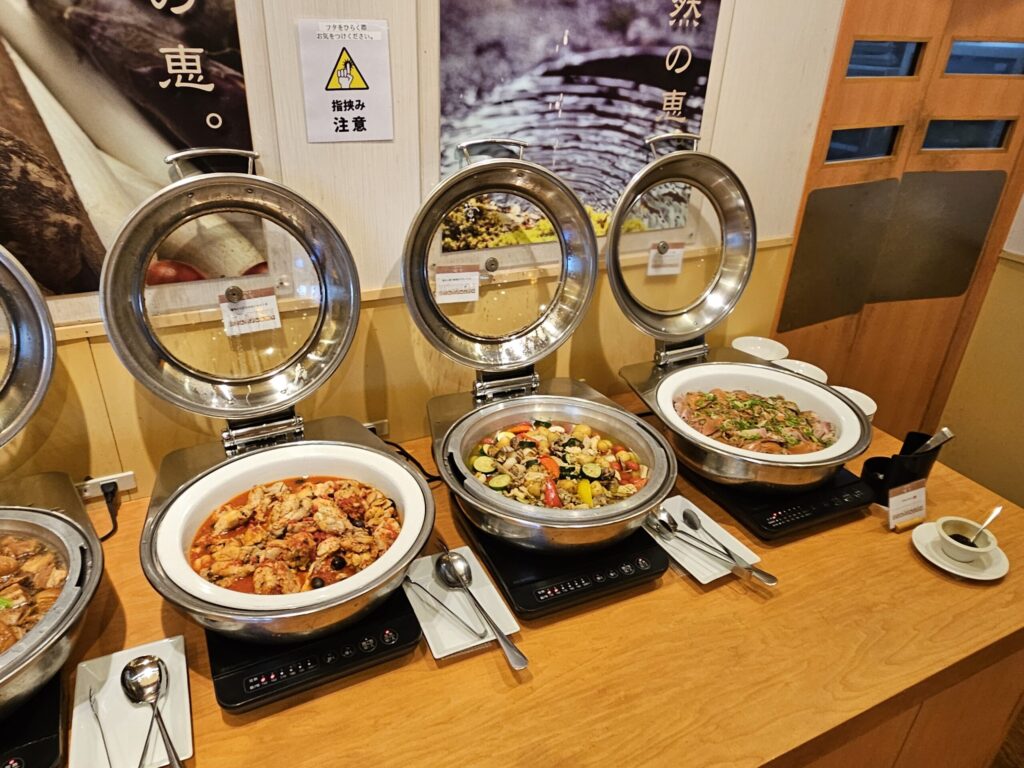 Buffet dishes at Tenpai no Sato in Chikushino, near Dazaifu Tenmangu Shrine — including stir-fried pork with cabbage (hoikoro).