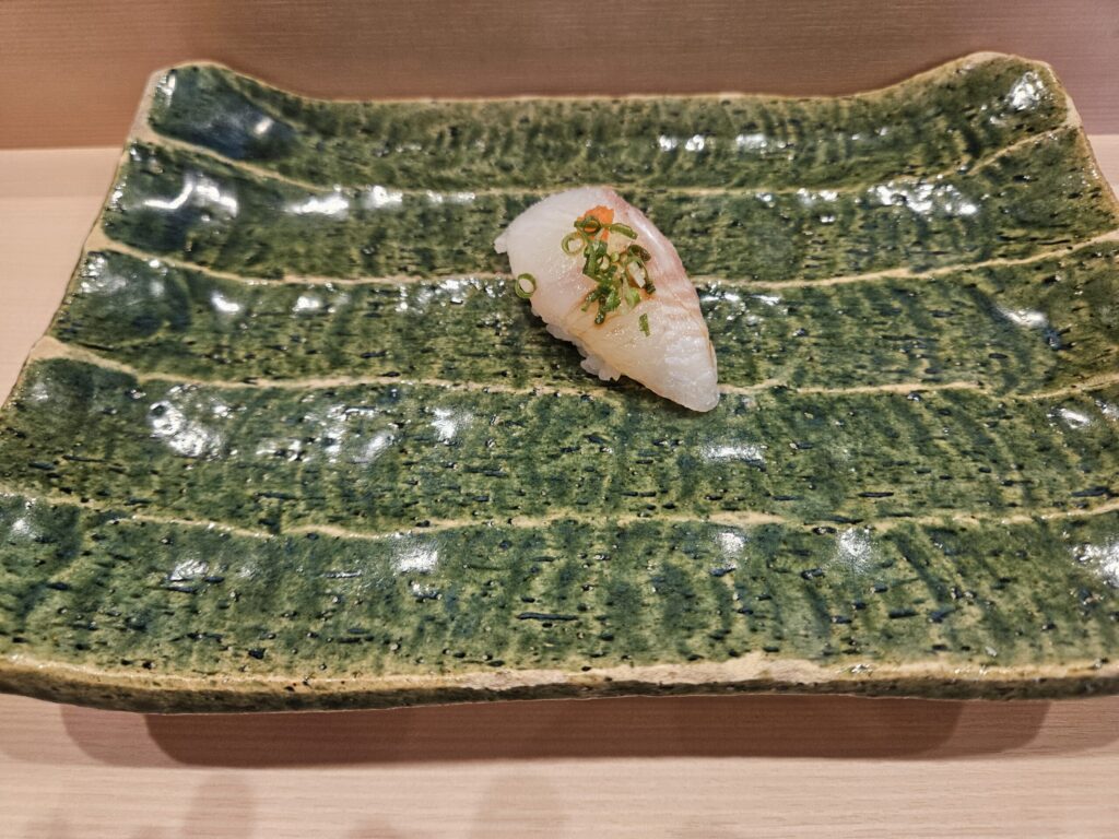 Hirame (flounder) sushi at Gin Sushi in Onojo, near Dazaifu — delicately seasoned with scallions and momiji oroshi.