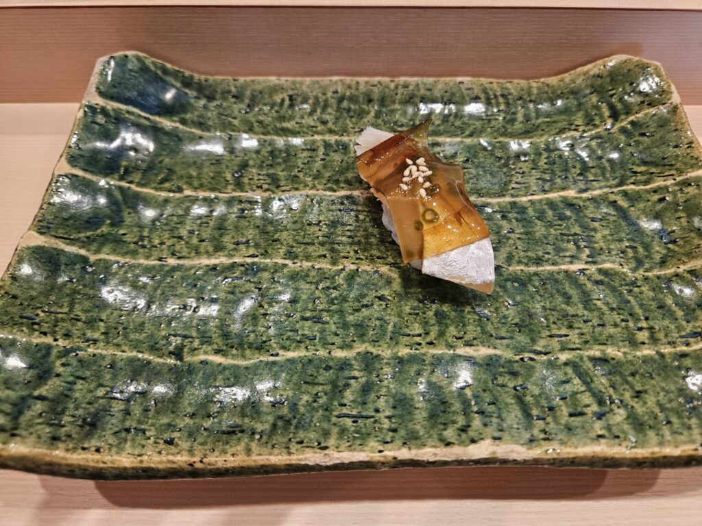 Aji (horse mackerel) sushi with soy-marinated kelp, served fresh at Gin Sushi in Onojo, near Dazaifu.