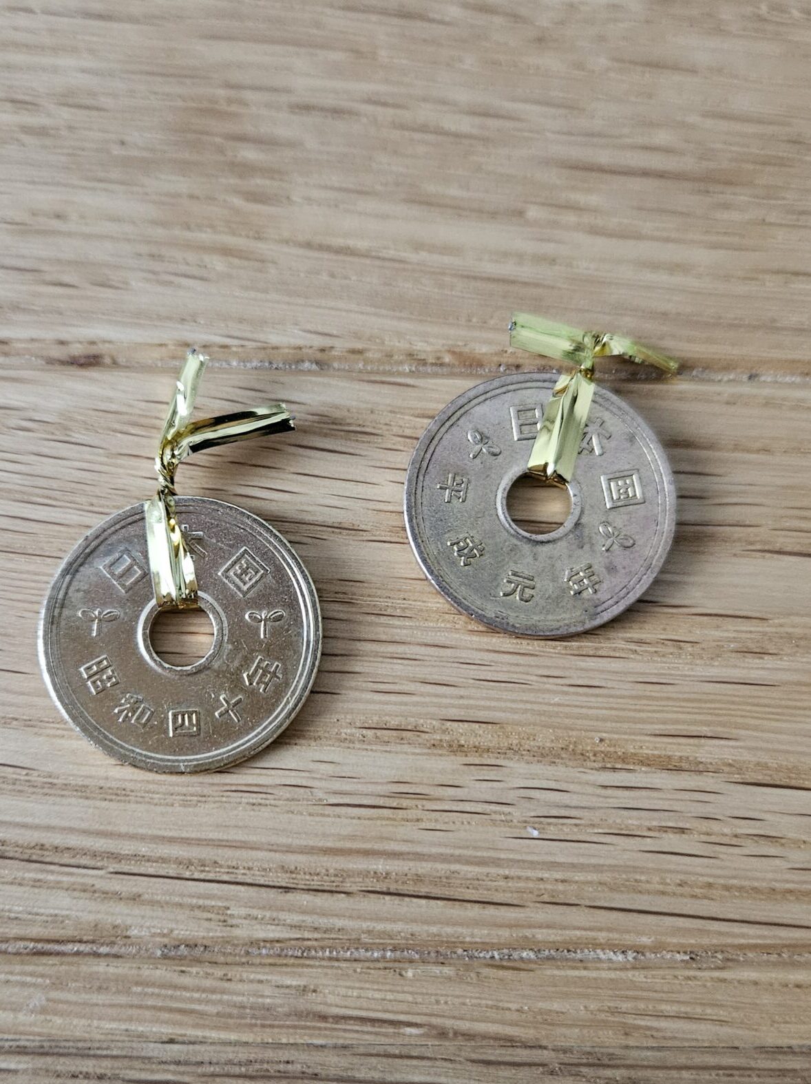 Two 5 yen coins received at Namiman, symbolizing good fortune and ‘enmusubi’ (connection)