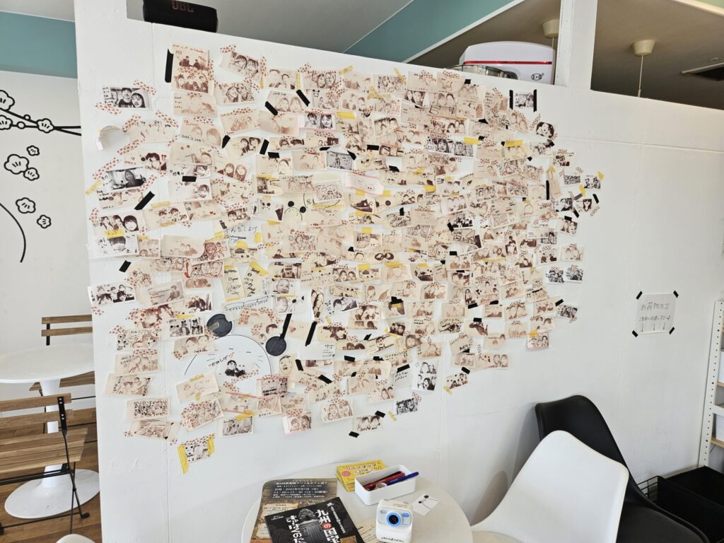 Unique wall display inside Chuta no Kissa café featuring customers’ own photos.