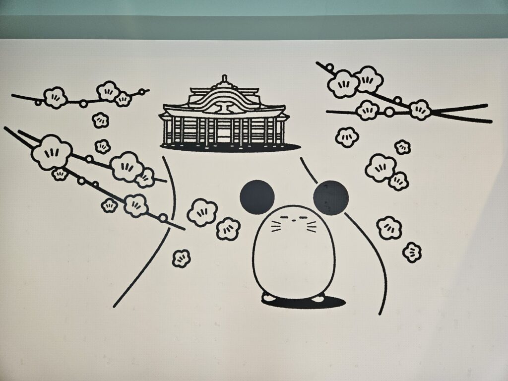 Wall art inside Chuta no Kissa café showing its original mouse character “Chuta.”