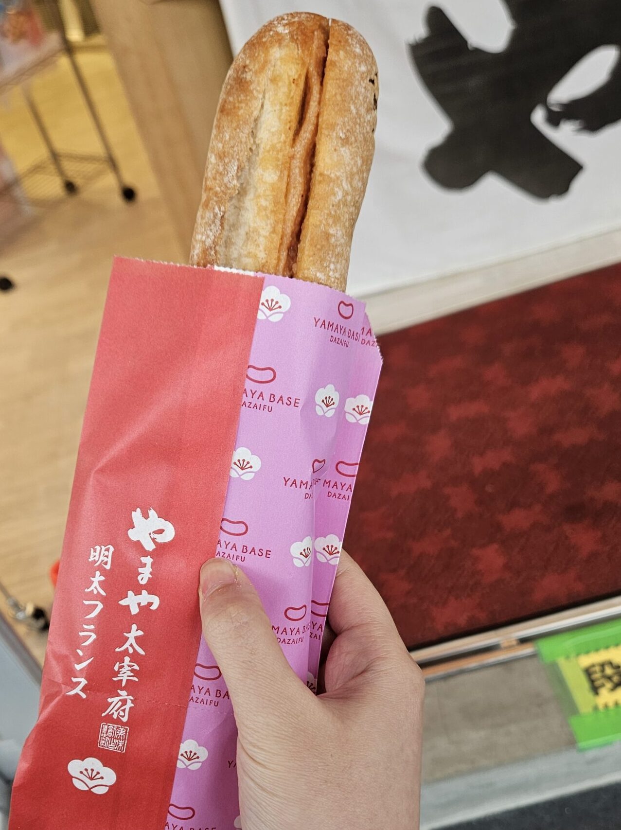Close-up of YAMAYA’s freshly baked Mentai French bread filled with mentaiko sauce