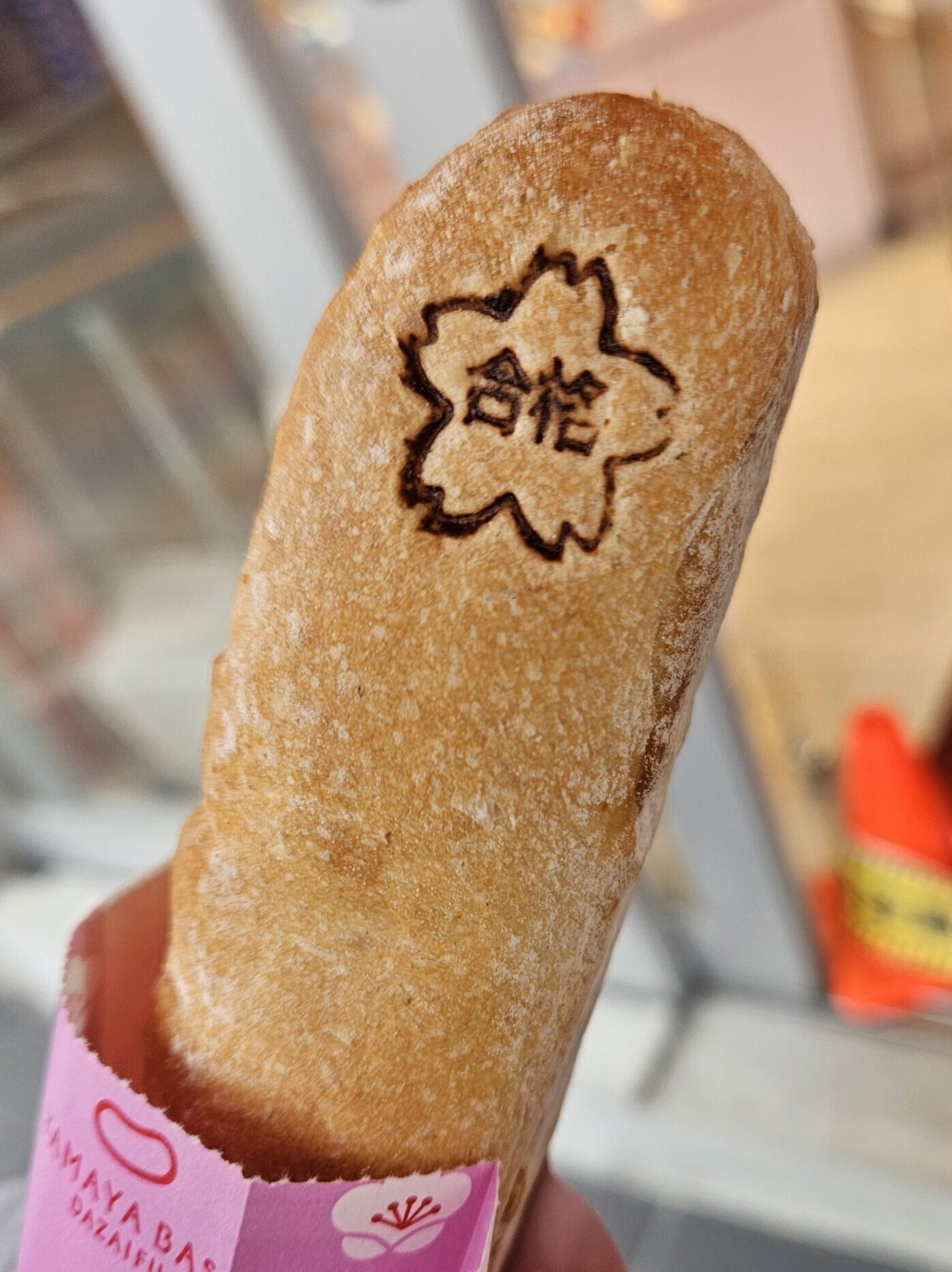 Close-up of the “Good Luck” stamp on YAMAYA’s Mentai French bread