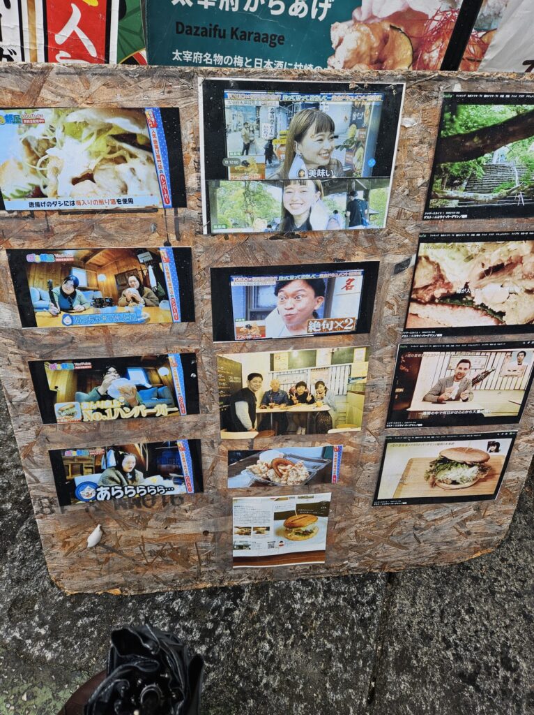 Promotional signboard of Chikushian on Dazaifu’s approach street, featuring photos from TV coverage.