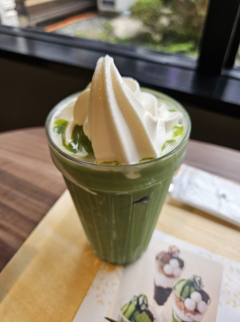 Close-up of a creamy matcha soft serve latte with a perfect balance of rich green tea and smooth milk.